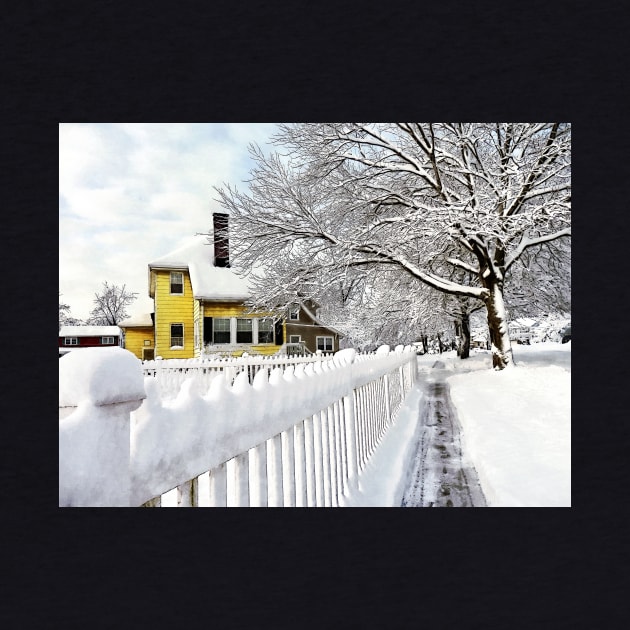 Yellow House with Snow Covered Picket Fence by SusanSavad